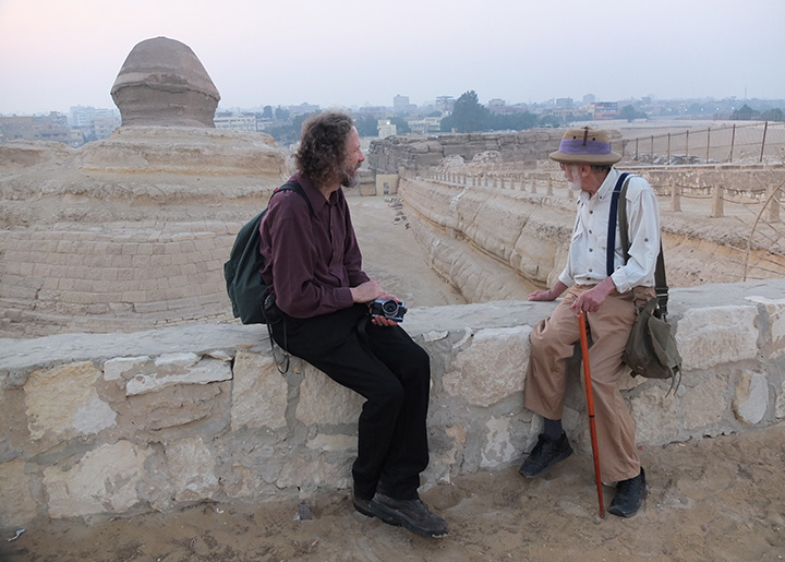 Robert Schoch and John Anthony West sitting together begind the Great Sphinx
